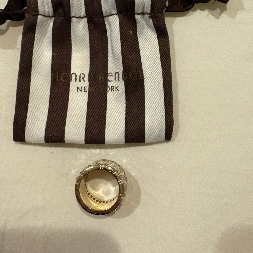 Henri Bendel Clear Stone and gold tone ring with Designer Pouch.
